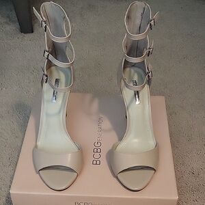 BCBGeneration Women's Cream Buckle Heels Chevonne